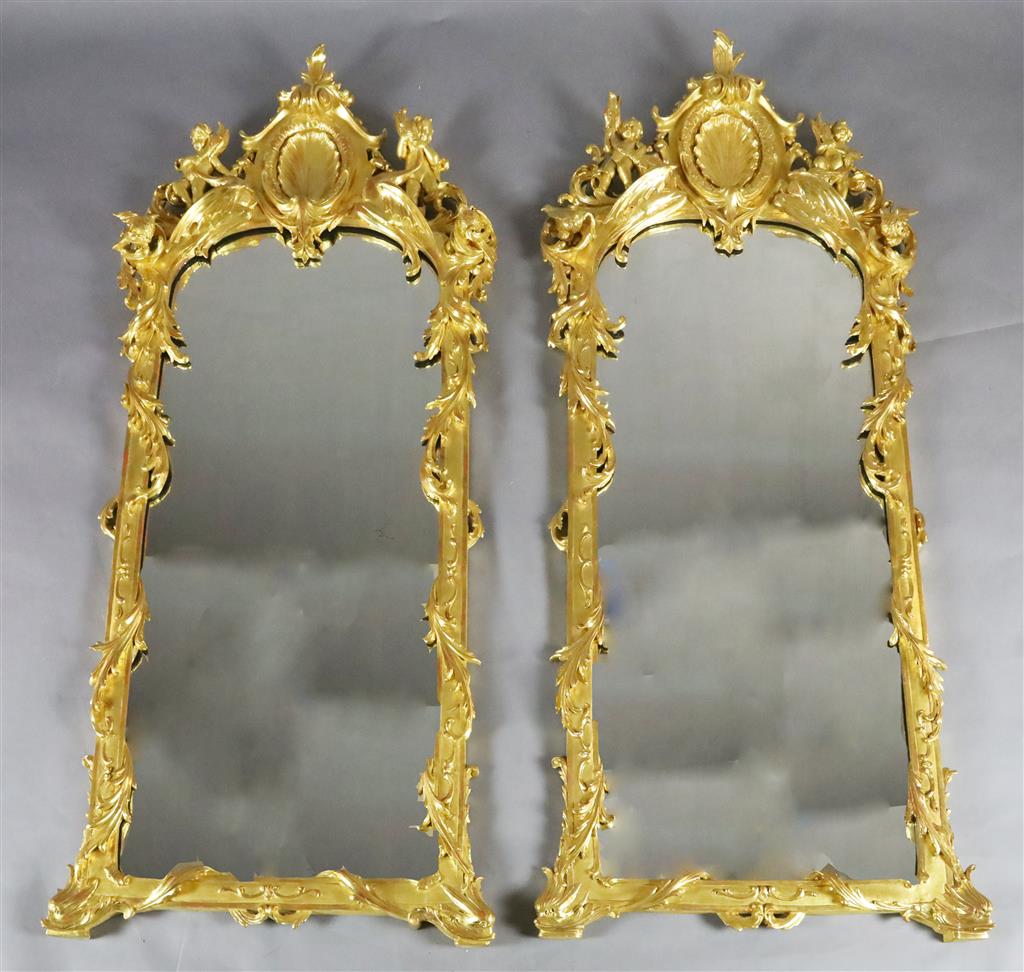 A pair of 19th century French carved giltwood wall mirrors, W.2ft 3in. H.5ft 1in.